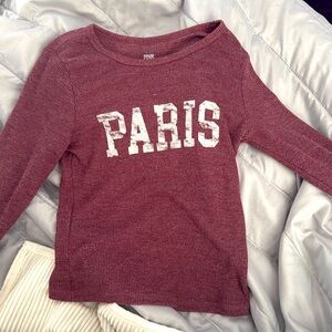 This shirt is from pink republic, a size small. It looks cropped but is not.